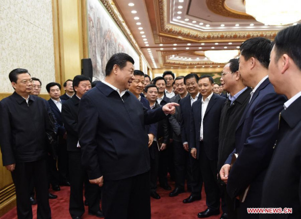 Chinese President Xi Jinping (front C), who is also general secretary of the Communist Party of China (CPC) Central Committee, speaks with participants of the first seminar for county-level Party chiefs at the Party School of the CPC Central Committee in Beijing, China, Jan 12, 2015. (Xinhua/Rao Aimin)