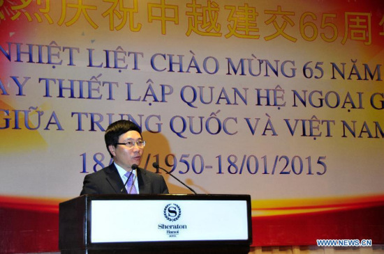 Vietnamese Deputy Prime Minister and Foreign Minister Pham Binh Minh addresses a reception held by Chinese Embassy in Vietnam to celebrate the 65th anniversary of the establishment of diplomatic relationship between China and Vietnam in Vietnam's capital Hanoi, Jan. 15, 2015. (Xinhua/Zhang Jianhua)