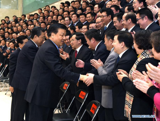 Liu Yunshan (front), president of the Party School of the Communist Party of China (CPC) Central Committee and a member of the Standing Committee of the Political Bureau of the CPC Central Committee, attends the 2014 autumn semester graduation ceremony of the Party School in Beijing, capital of China, Jan. 15, 2015. (Xinhua/Rao Aimin)