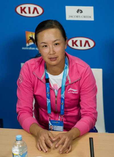 Peng Shuai of China reacts during the press conference after her women's singles fourth round match against Maria Sharapova of Russia at the Australian Open tournament in Melbourne, Australia, Jan. 25, 2015. Maria Sharapova won 6-3 6-0. (Xinhua/Jin Linpeng)