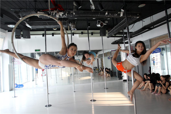 Students train at the Luolan Pole Dance School in Beijing.