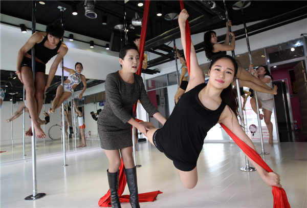 Students train at the Luolan Pole Dance School in Beijing.