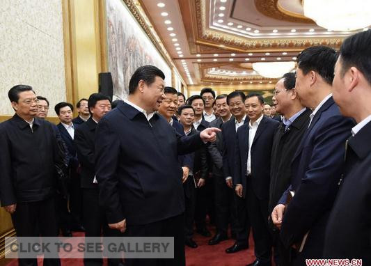 Chinese President Xi Jinping (front C), who is also general secretary of the Communist Party of China (CPC) Central Committee, speaks with participants of the first seminar for county-level Party chiefs at the Party School of the CPC Central Committee in Beijing, China, Jan 12, 2015. (Xinhua/Rao Aimin)