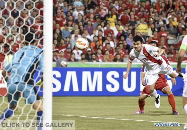 Sun Ke of China scores his second goal during a group B match between China and the Democratic People's Republic of Korea of the AFC Asian Cup in Canberra, Australia, Jan 18, 2015. China won 2-1. (Xinhua/Qin Qing) 