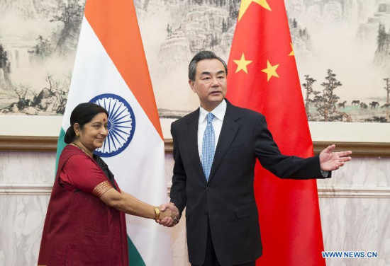 Chinese Foreign Minister Wang Yi (R) meets with his Indian counterpart Sushma Swaraj in Beijing, China, Feb. 1, 2015. (Xinhua/Huang Jingwen)