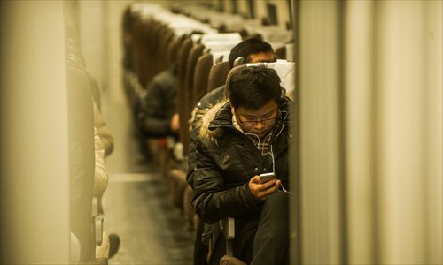 A passenger on the recently discontinued D9023 bullet train that ran from Beijing to Yanjiao. Photo: Li Hao/ GT