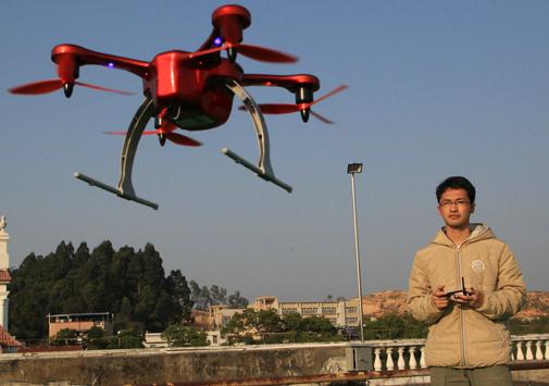 A technician from Ehang Inc tests a drone. EHang has sold over 3,000 unmanned aerial vehicles. [Photo provided to China Daily]  