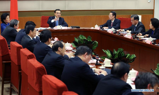 Chinese Premier Li Keqiang presides over a symposium to solicit opinions from members of China's non-Communist parties, representatives of industry and commerce federations and personages without party affiliation on the draft of an annual government work report in Beijing, capital of China. (Xinhua/Yao Dawei)
