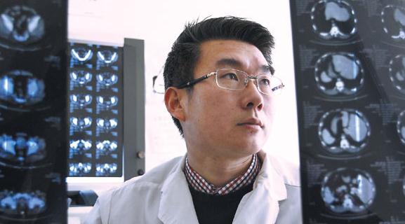 Tian Long, director of the urology department in Chaoyang Hospital in Beijing, checks an X-ray. The department performs about 1,000 circumcisions every year, and most patients opt for the Shang Ring, even though it costs 1,200 yuan ($192) to 1,300 yuan, double that of conventional surgery. Zhang Wei / China Daily