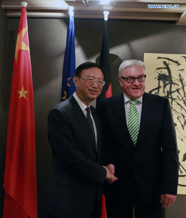 Chinese State Councilor Yang Jiechi (L) meets with German Foreign Minister Frank-Walter Steinmeier, in Munich, Germany, on Feb.7, 2015. (Xinhua/Luo Huanhuan)
