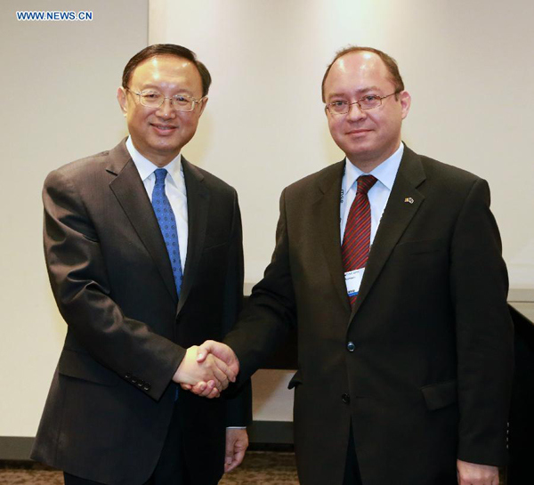 Chinese State Councilor Yang Jiechi (L) meets with Romanian Foreign Minister Bogdan Aurescu, in Munich, Germany, on Feb.6, 2015. (Xinhua/Luo Huanhuan)