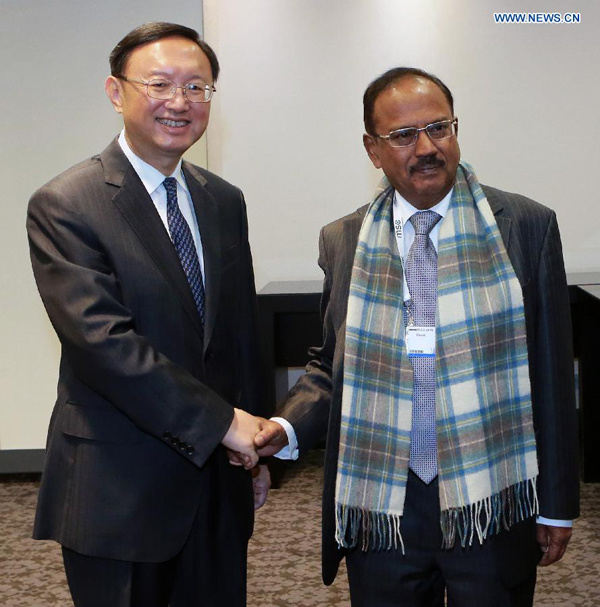 Chinese State Councilor Yang Jiechi (L) meets with Indian National Security Advisor Ajit Kumar Doval on the sidelines of the ongoing 51th Munich Security Conference, in Munich, Germany, on Feb.7, 2015. (Xinhua/Luo Huanhuan)