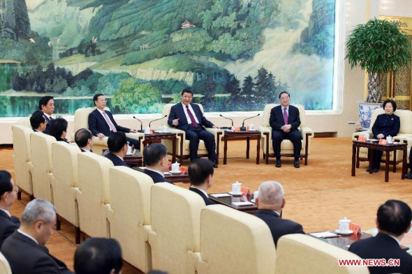 Chinese President and general secretary of the Communist Party of China (CPC) Central Committee Xi Jinping (3rd R rear), chairman of the National Committee of the Chinese People's Political Consultative Conference Yu Zhengsheng (2nd R rear), and Vice Premier Zhang Gaoli (4th R rear) celebrate the upcoming Spring Festival with non-CPC social figures in Beijing, China, Feb. 11, 2015. (Xinhua/Yao Dawei)