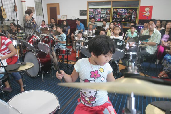 Drum class at Deshengmen Youth Palace in Xicheng District, a government-supported community school in Beijing. Photo provided to China Daily