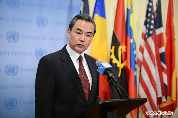 Chinese Foreign Minister Wang Yi holds a press conference after presiding over a United Nations Security Council open debate on international peace and security at the UN headquarters in New York, the United States, on Feb. 23, 2015. (Xinhua/Niu Xiaolei)