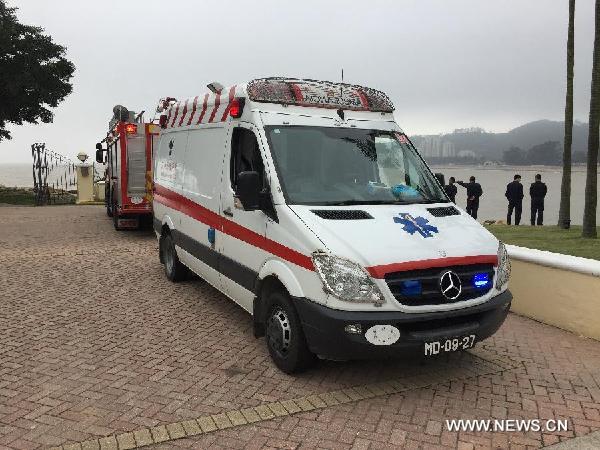 An ambulance arrives at the accident scene where a ferry capsized in Macao, south China, Feb. 27, 2015. A ferry carrying 19 people capsized Friday off China's Macao, and four people have been rescued, the customs said. The sunken ferry is a smuggling boat, with one captain, two sailors and 16 other stowaways on board, according to the customs. The four rescued are all stowaways, while other 15 people are still missing, said the customs. (Xinhua/Cheong Kam ka)