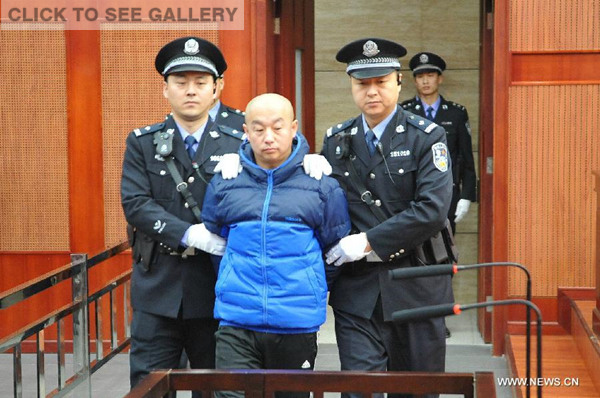 Alleged serial killer Zhao Zhihong is escorted to stand trial for murder, rape, robbery and larceny at the Hohhot Intermediate People's Court in Hohhot, capital of north China's Inner Mongolia Autonomous Region, Feb. 9, 2015. (Xinhua)