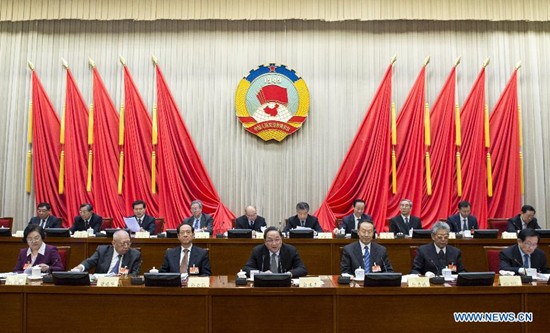 Yu Zhengsheng (C front), chairman of the National Committee of the Chinese People's Political Consultative Conference (CPPCC), speaks at the closing meeting of the 9th session of the Standing Committee of the 12th CPPCC National Committee in Beijing, China, Feb. 28, 2015. (Xinhua/Wang Ye)