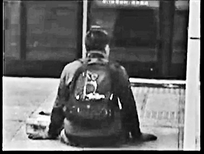 A beggar disguised as a crippled man on Subway Line 5 in Beijing. (Photo/BTV)