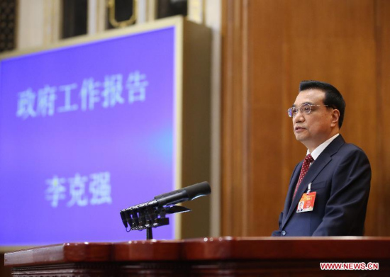 Chinese Premier Li Keqiang delivers the government work report during the opening meeting of the third session of China's 12th National People's Congress (NPC) at the Great Hall of the People in Beijing, capital of China, March 5, 2015. (Xinhua/Lan Hongguang)