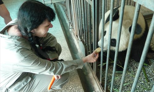 Cottle feeds a panda on the base. (Photo: Courtersy of Cottle)