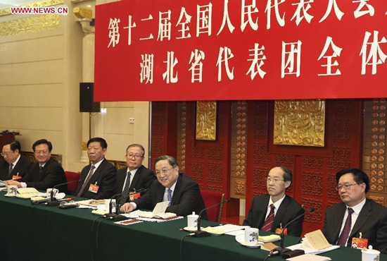Yu Zhengsheng (3rd R), chairman of the National Committee of the Chinese People's Political Consultative Conference (CPPCC) and a member of the Standing Committee of the Political Bureau of the Communist Party of China (CPC) Central Committee, joins a panel discussion of deputies to the 12th National People's Congress (NPC) from central China's Hubei Province, in Beijing, capital of China, March 5, 2015. (Xinhua/Pang Xinglei)