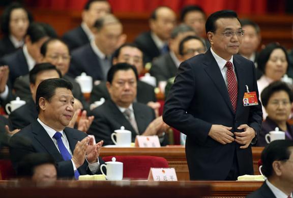 Premier Li Keqiang prepares to deliver the Government Work Report at the opening meeting of the NPC's annual session in Beijing on Thursday, watched by President Xi Jinping. (Photo: China Daily/by Wu Zhiyi) 