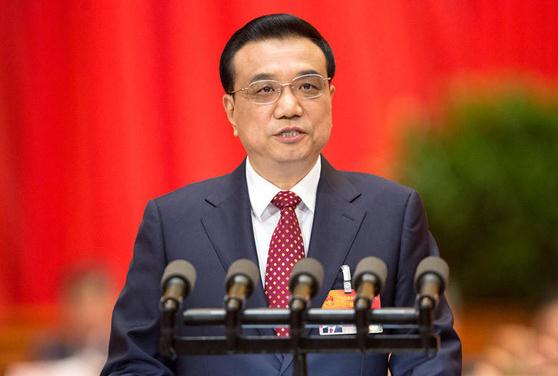 Chinese Premier Li Keqiang delivers a government work report on the opening day of the third session of the 12th National People's Congress in Beijing, March 5, 2014. (Photo/china.com.cn) 