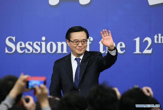 Chinese Minister of Commerce Gao Hucheng gives a press conference for the third session of China's 12th National People's Congress (NPC) on commercial development and opening up, in Beijing, capital of China, March 7, 2015. (Photo: Xinhua/Xing Guangli) 