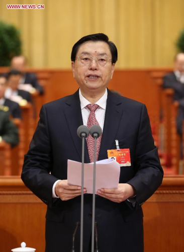 Zhang Dejiang, chairman of the Standing Committee of China's National People's Congress (NPC), presides over the closing meeting of the third session of the 12th NPC at the Great Hall of the People in Beijing, capital of China, March 15, 2015. (Xinhua/Lan Honggguang)