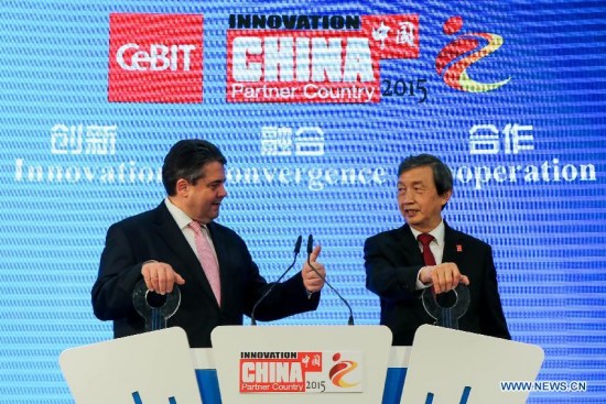 Chinese Vice Premier Ma Kai (R) and German Vice-Chancellor and Economy and Energy Minister Sigmar Gabriel attend a launching ceremony at China's stand in the high-tech trade fair CeBIT 2015 in Hanover, Germany, on March 16, 2015. A central pavilion featuring Chinese IT companies at CeBIT opened to visitors on Monday. (Xinhua/Zhang Fan)