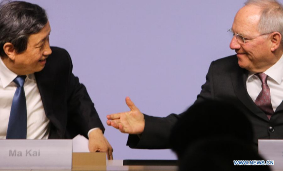 Chinese Vice Premier Ma Kai (L) and German Finance Minister Wolfgang Schaeuble attend a press conference in Berlin, capital of Germany, on March 17, 2015. Germany confirmed to join the Asian Infrastructure Investment Bank (AIIB), German Finance Minister Wolfgang Schaeuble said on Tuesday. (Xinhua/Zhang Fan)