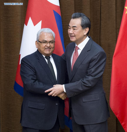 Chinese Foreign Minister Wang Yi(R) meets with Nepal Minister of Foreign Affairs Mahendra Bahadur Pandey in Beijing of China on March 18, 2015.(Xinhua/Wang Hua)