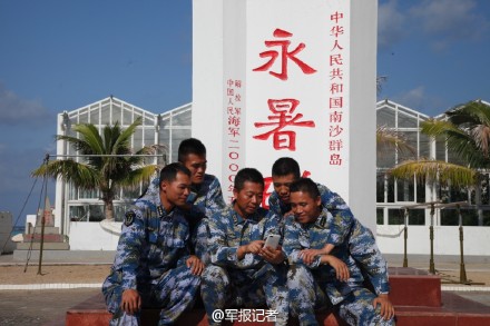 Photo shows that the Chinese soldiers, stationed on the Yongshu Reef of Nansha Islands, south China sea, are using the fourth-generation (4G) mobile network with a cell phone on March 19, 2015.