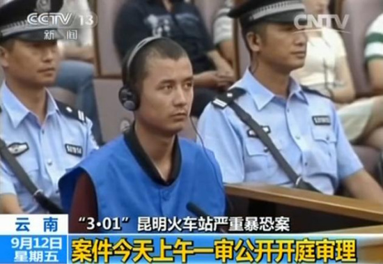 Screen shot from China Central Television's news program shows a suspect of the Kunming train station terrorist attack sitting in the intermediate court of Kunming, the capital city of Southwest China's Yunnan province in this Sept 12, 2014 file photo. [Photo /screen shot from China Central Television]