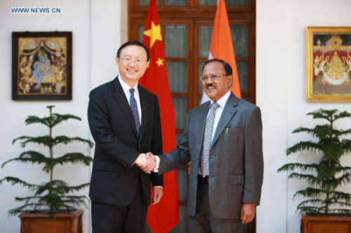 Chinese State Councilor Yang Jiechi (L), who is also Chinese Special Representative on China-India Boundary Question, shakes hands with Indian National Security Advisor Ajit Doval at Hyderabad House in New Delhi, India, March 23, 2015. (Xinhua/Zheng Huansong)