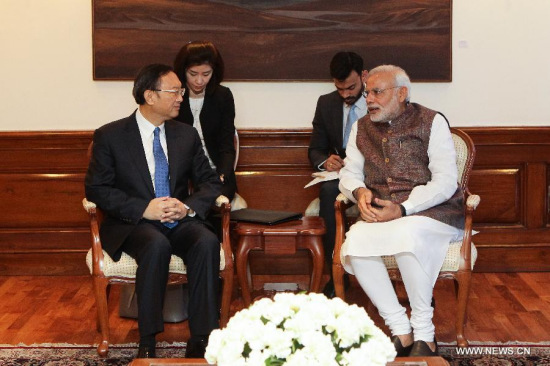 Indian Prime Minister Narendra Modi (R) meets with Chinese State Councilor Yang Jiechi in New Delhi March 24, 2015. Narendra Modi on Tuesday told Yang Jiechi that he is ardently expecting to visit China soon to exchange views with Chinese leaders on furthering the bilateral relations. (Xinhua/Zheng Huansong)