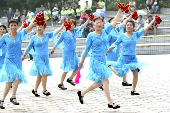 Public dancing is a consequence of China's rapidly aging society, observers say. [Photo by Zou Hong/China Daily]