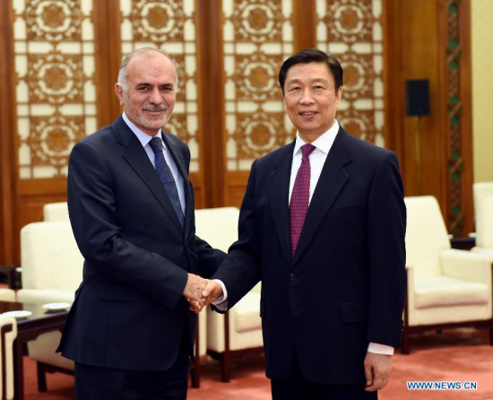 Chinese Vice President Li Yuanchao (R) meets with a delegation headed by Sadiq al-Rikabi from the Islamic Dawa Party of Iraq in Beijing, capital of China, March 25, 2015. (Xinhua/Rao Aimin)