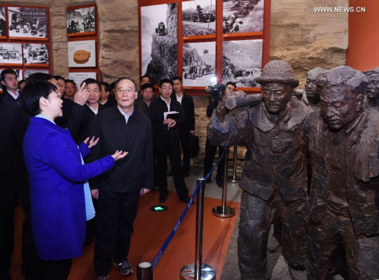Wang Qishan (front, R), a member of the Standing Committee of the Political Bureau of the Communist Party of China (CPC) Central Committee and secretary of the CPC Central Commission for Discipline Inspection, visits the Hongqiqu Memorial in Linzhou, central China's Henan Province, March 27, 2015. Wang made an inspection tour to Henan from March 27 to 28 and presided over a symposium here. (Xinhua/Rao Aimin) 