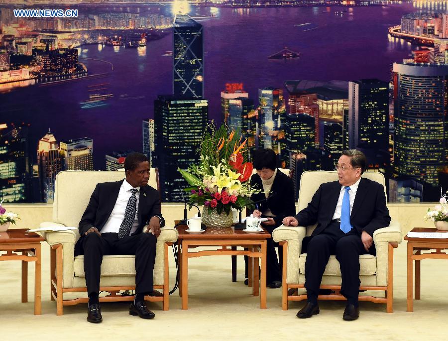 Yu Zhengsheng (R), chairman of the National Committee of the Chinese People's Political Consultative Conference, meets with Zambian President Edgar Lungu in Beijing, capital of China, March 30, 2015. (Photo: Xinhua/Rao Aimin)