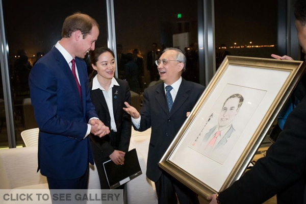 Britain's Prince William, the Duke of Cambridge, receives a portrait of himself after the opening ceremony of the Great Festival of Creativity at the Long Museum in Shanghai's Xuhui District yesterday. The three-day festival is showcasing UK companies of interest to Chinese investors. (Photo/Shanghai Daily)