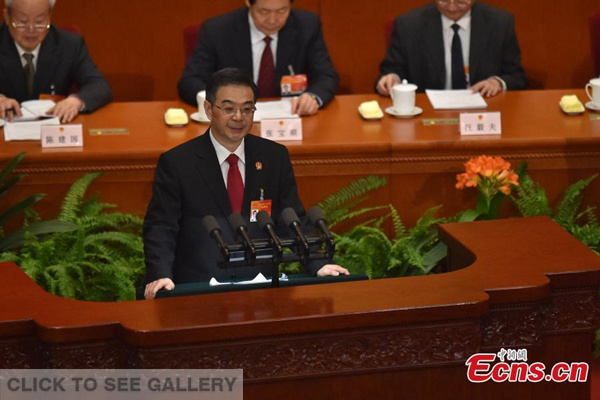 Zhou Qiang, president of the Supreme People's Court (SPC), delivers a report on the SPC's work during the third plenary meeting of the Third Session of the 12th National People's Congress (NPC) at the Great Hall of the People in Beijing, capital of China, March 12, 2015. (Photo: China News Service/Jin Shuo)