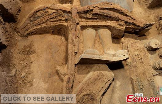 A view of a complete crossbow relic found during the third excavation of the number one pit of the Qin terracotta warriors and horses in Xi'an, Northwest China's Shaanxi province. Archaeologists said it is the first time a complete crossbow has been found in the pit. The excavation also uncovered a qing, a tool to adjust the crossbow and keep it from deforming. The tool is mentioned in historical records but was previously unseen. (Photo: China News Service/Zhang Tianzhu)