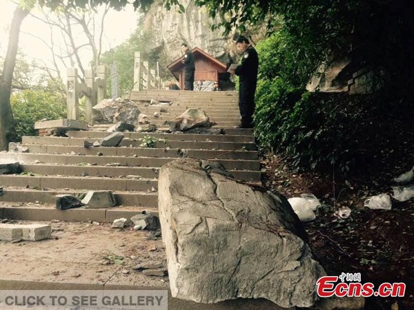 Falling rocks scatter on mountain stairs at a scenic spot in Guilin, Southwest China's Guangxi Zhuang autonomous region, March 19, 2015. Seven tourists were killed by falling rocks when they were about to board their boats for a tour in the area. (Photo: China News Service/Tang Mengxian)