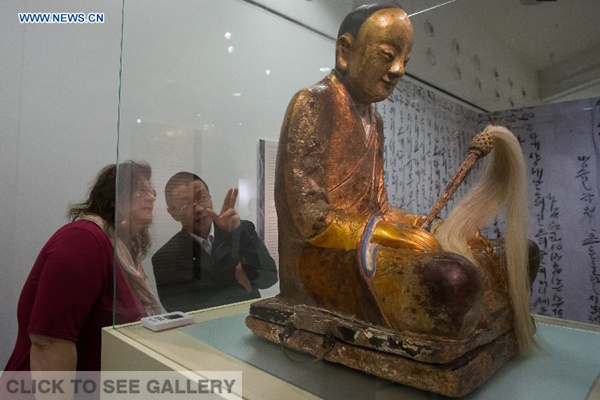 File photo taken on March 3, 2015 shows the Chinese Buddha statue at the Hungarian Natural History Museum in Budapest, Hungary. A Buddha statue that conceals the mummified remains of an ancient monk was withdrawn from the Hungarian Natural History Museum by its Dutch owner in Budapest on Friday. Villagers living in Yangchun, a village in China's southeastern province of Fujian, claimed that this statue was the one stolen from their village's temple in 1995, Chinese media reported recently. (Xinhua/Attila Volgyi)
