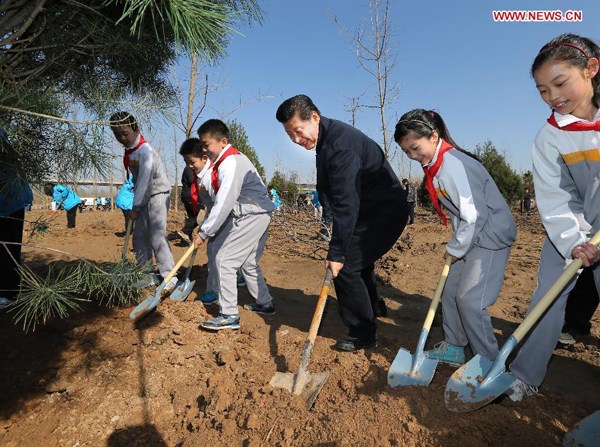 Chinese President Xi Jinping (3rd, R) plants a sapling together with pupils during a tree-planting event in Sunhe Township of Chaoyang District in Beijing, capital of China, April 3, 2015. Top Communist Party of China (CPC) and state leaders Xi Jinping, Li Keqiang, Zhang Dejiang, Yu Zhengsheng, Liu Yunshan, Wang Qishan and Zhang Gaoli attended a tree planting event in Beijing on Friday. (Xinhua/Lan Hongguang)