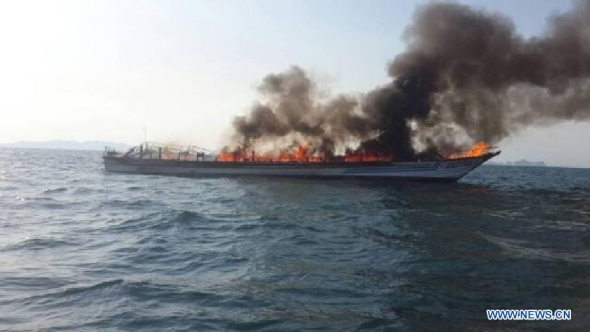 Photo taken on April 8, 2015 shows smoke rising from the exploded boat near Phuket Island, Thailand. A tour boat carrying about 100 tourists exploded and burst into flames near Thailand's Phuket Island on Wednesday afternoon, with casualties still uncertain, China's consular office in Phuket said. (Xinhua/Stringer)