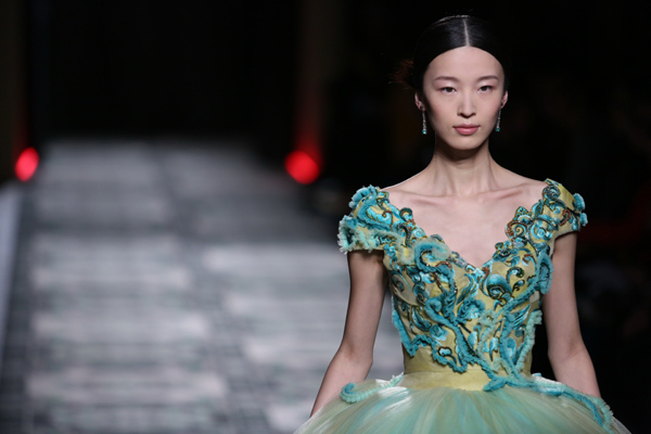 A model presents creations by Laurence Xu at the Paris Haute Couture Fashion Week. Photo provided to China Daily  