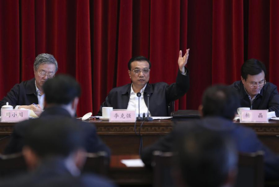 Chinese Premier Li Keqiang(C) presides over a symposium on the economic work of northeastern provinces of Liaoning, Jilin and Heilongjiang, in Changchun, Jilin, April 10, 2015. (Xinhua/Ding Lin)
